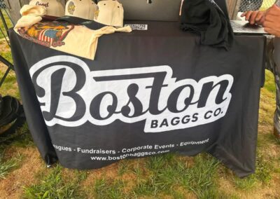 Boston Baggo Company registration table at the cornhole tournament fundraiser