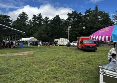 Teams playing cornhole on the Ellis Haven ball field