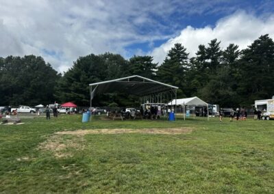 A full ball field of cornhole teams