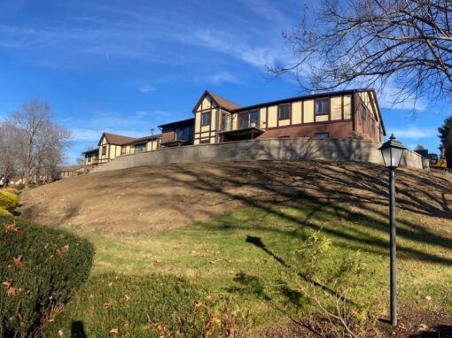 Long graded hillside below a townhouse complex