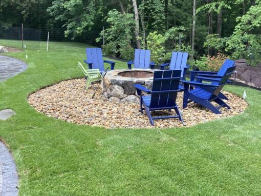 Fire pit circle with Adirondack chairs, the kind of spot mosquito and tick spraying protects