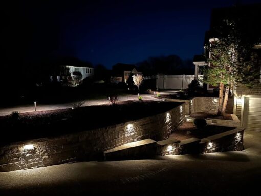 Block wall with built-in lights and steps glowing at night