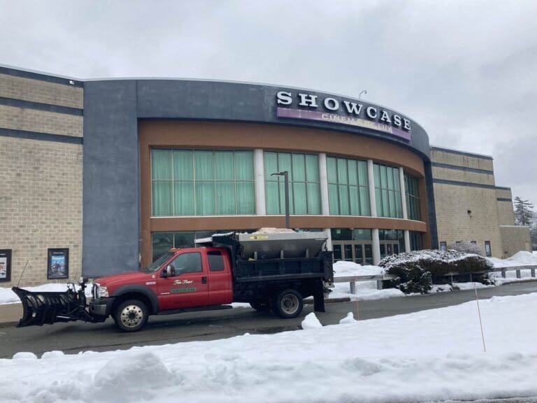 Snow management at a commercial property: plow truck with a dump body